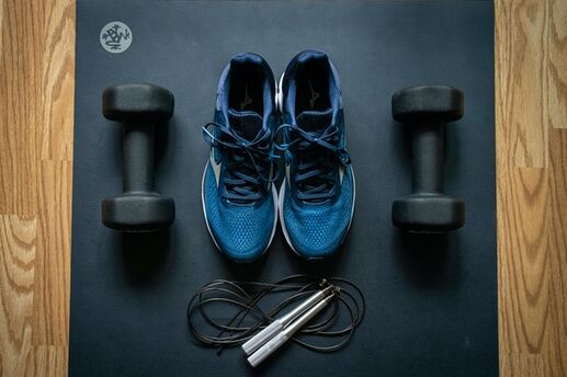 a pair of sneakers with weights and jump rope
