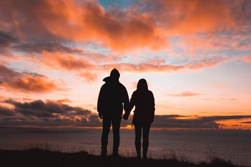couple at the beach at sunset